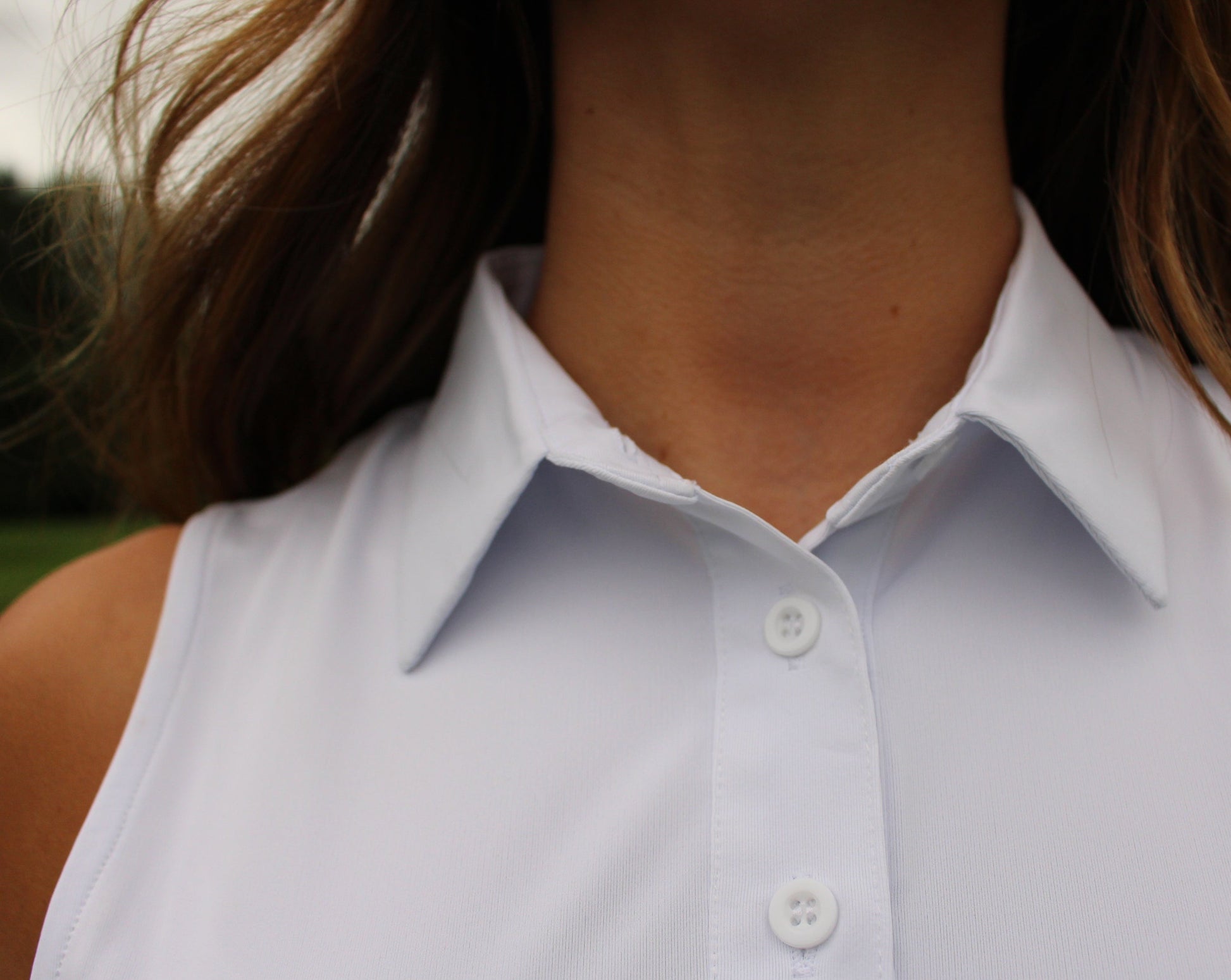 Close up collar of White Sleeveless Golf Polo Shirt