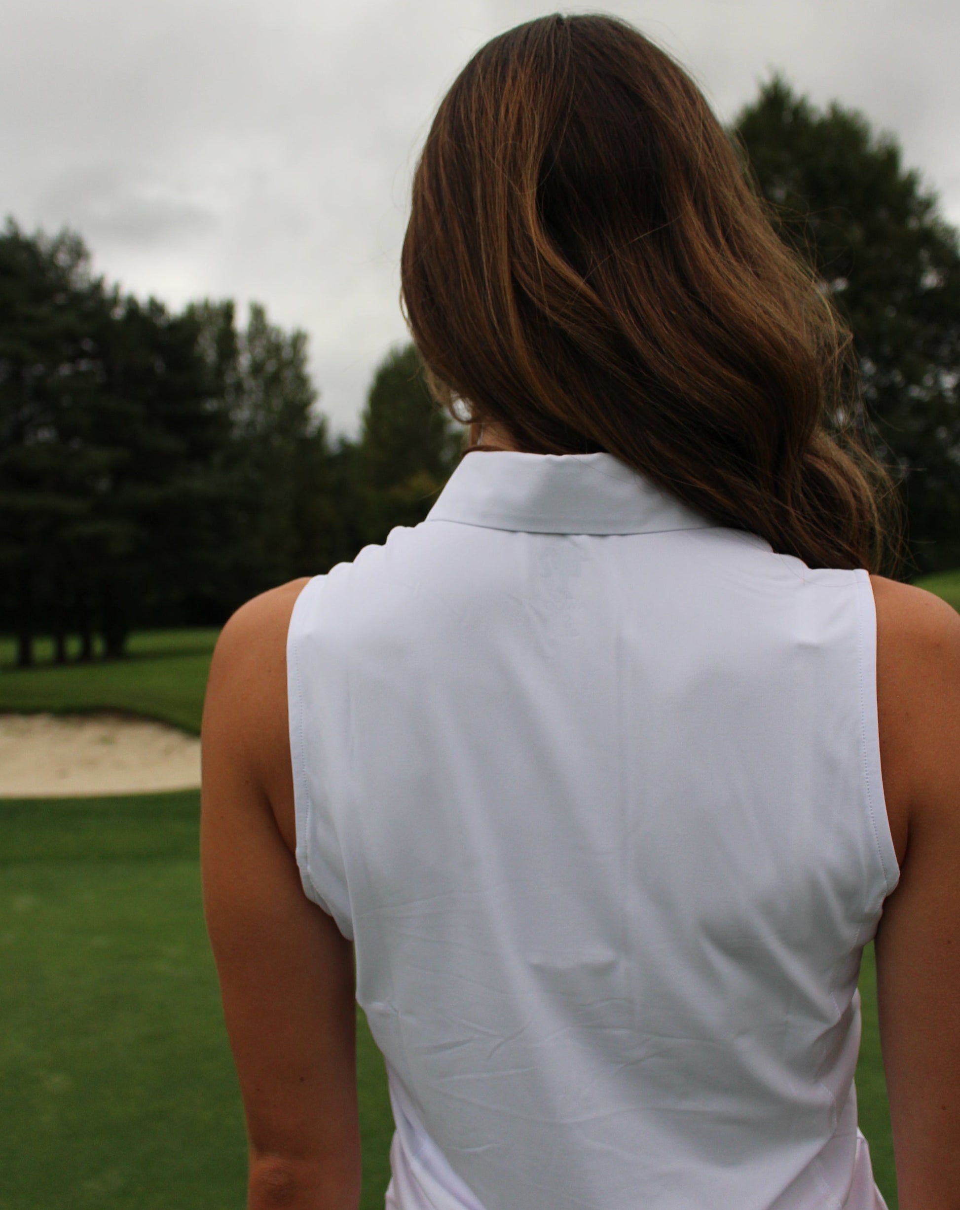 Women's White Sleeveless Golf Polo-Shirt - AWGO Golf High-Quality Golf Apparel for Women - AWGO Golf Premium Performance Golf Polo-Shirt  Fashionable Golf Clothing for Women  Stretch Fabric Golf Polo-Shirt - AWGO Golf Elegant Women's Golf Attire - AWGO Golf Athletic Women's Activewear - AWGO Golf Empowering Golf Fashion for Women - AWGO Golf Golf Polo-Shirt with Flattering Silhouette - AWGO Golf Comfortable Golf Apparel for Female Golfers - AWGO Golf Back of White Sleeveless Polo Shirt